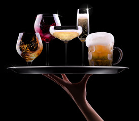 set with different drinks on black background