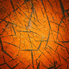 Vignette style orange color cracked paint texture