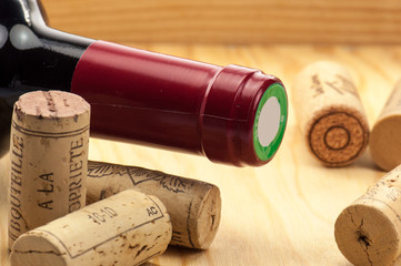 Wine and corks on wooden table