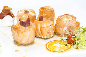 baked salmon rolls on a table in a restaurant