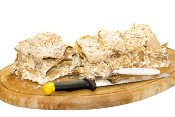 napoleon cake on a wooden tray in a restaurant