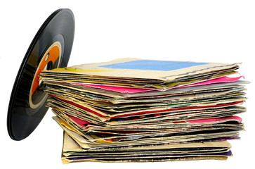 45 rpm vinyl discs stack on white background