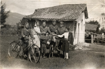 Fototapeta na wymiar soldiers and villagers - circa 1940