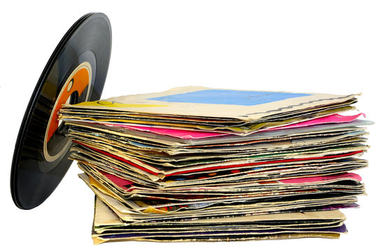 45 rpm vinyl discs stack on white background