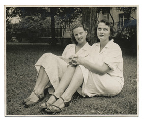 Two nurses on the lawn - circa 1950