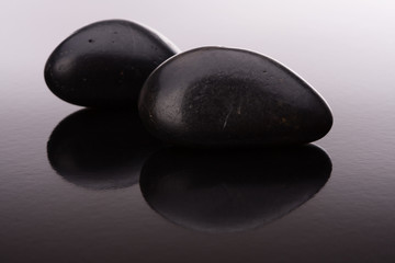 Spa stone arrangement on black surface