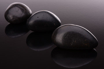 Spa stone arrangement on black surface
