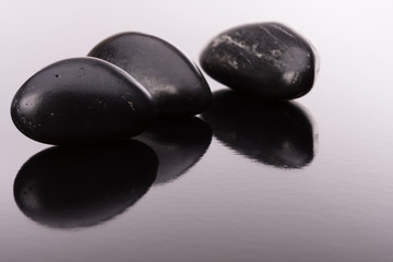 Spa stone arrangement on black surface