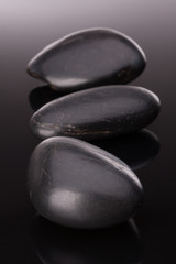 Spa stone arrangement on black surface