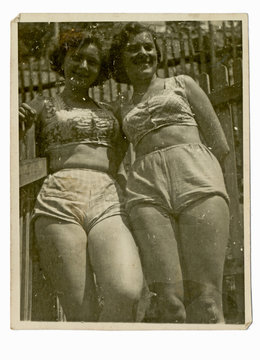 two girls on summer break  in bathing suits  - circa 1945