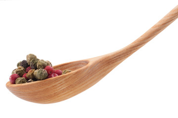 Pepper seasoning  mix in wooden spoon isolated on white backgrou