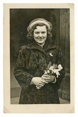 CIRCA 1949 - young bride with flowers