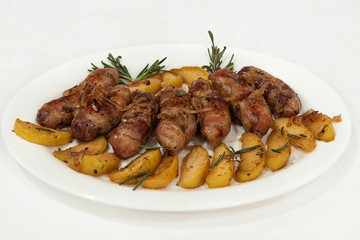 meat sausages with baked apples and rosemary