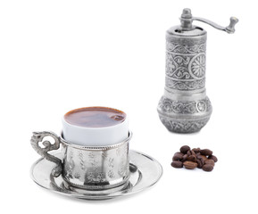 Turkish coffee with coffee beans isolated on white