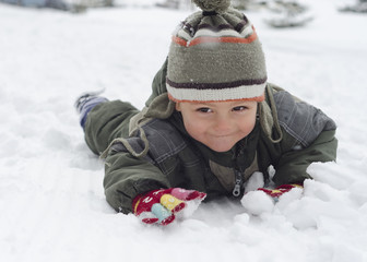 Child in snow in winter