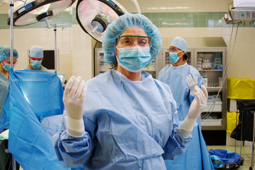 Scrub nurse gowned and gloved