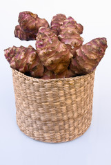 Jerusalem artichoke root with basket (Helianthus tuberosus)