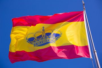 Spain red and yellow flaw waving on wind