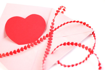 Envelope with red hearts ribbon