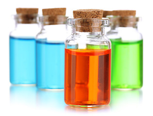 Bottles with basics oils isolated on white