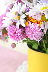 Wildflowers in mug on napkin on wooden table