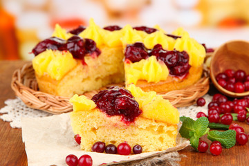 Tasty fruity homemade pie with berries, on brown wooden table