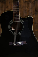 Fototapeta premium Acoustic guitar on wooden background