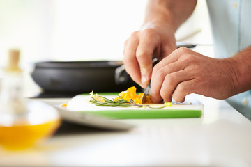 Obraz na płótnie Canvas Close Up Of man Preparing Ingredients For Meal