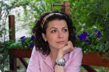 Woman sitting at a table watching