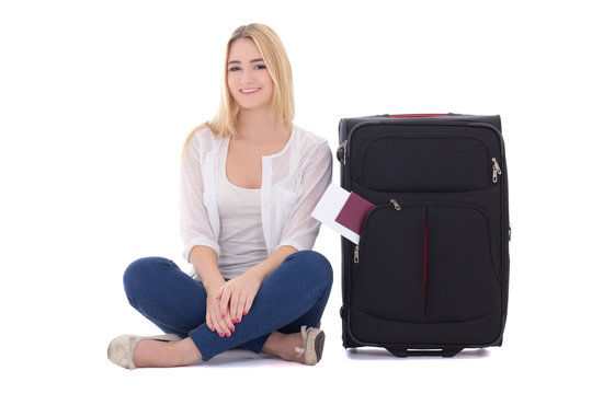 attractive blondie woman with suitcase, passport and ticket sitt