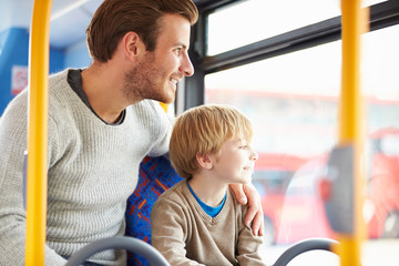 Father And Son Enjoying Bus Journey Together © Monkey Business