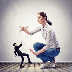 Businesswoman puppeteer