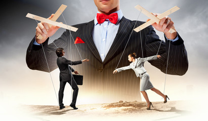 Businessman puppeteer