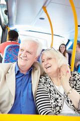 Senior Couple Enjoying Journey On Bus