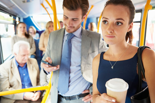 Passengers Standing On Busy Commuter Bus