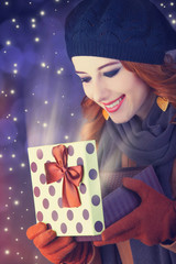 Redhead girl with gift.