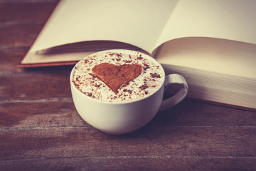 Cup of coffee with books
