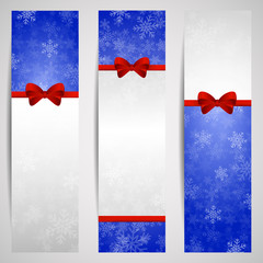 Three vertical winter banners with red ribbons, place fo text an