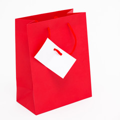 Red shopping bag with greeting card