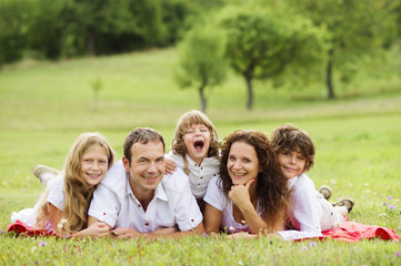 Big family is relaxing in green nature