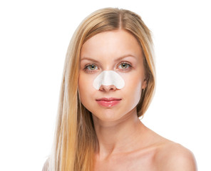 Portrait of teenage girl with clear-up strips on nose