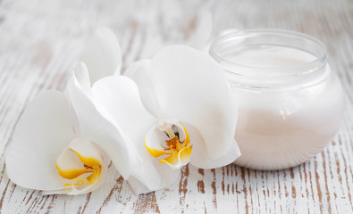 Face cream with orchids flowers