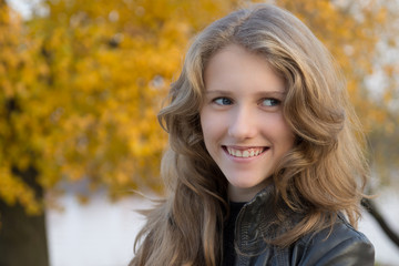 Beautiful young smiling girl outdoors