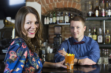 and the bartender girl near the bar