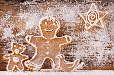 Festive gingerbread on wooden background