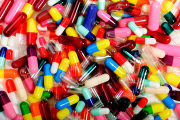 Empty medicinal capsules in varying colors, sizes and styles.