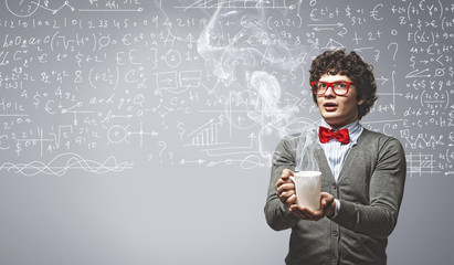 Young man with smoke coming out of cup