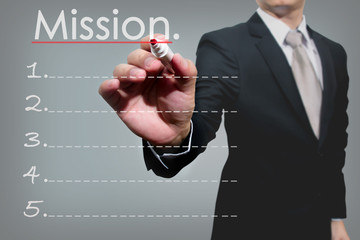 business man hand checking mission.