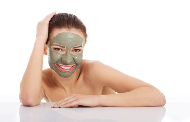 Beautifu toplessl woman with facial mask.
