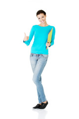 Fototapeta premium beautiful casual woman holding files and showing OK.